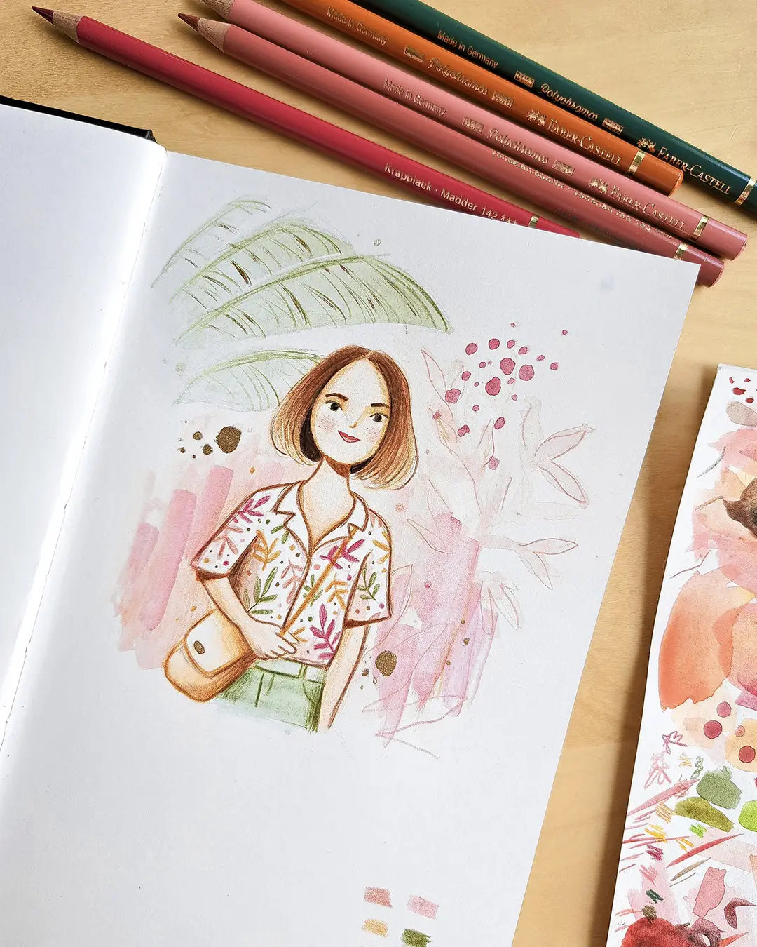 Page de carnet de croquis avec l'illustration d'une femme vêtue d'une blouse imprimée, dans un décor à la fois abstrait et tropical.