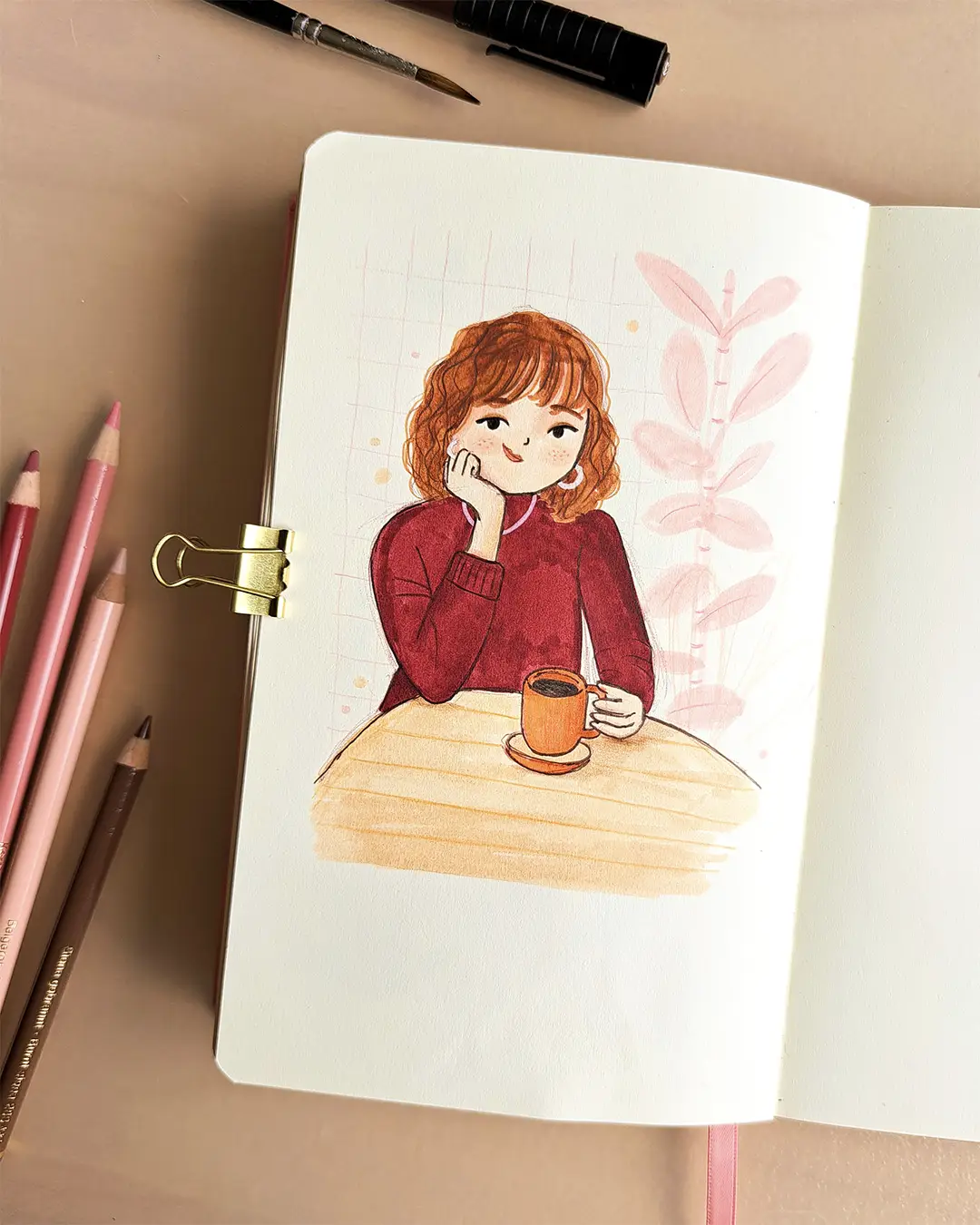 Page de carnet de croquis avec l'illustration d'une femme accoudée à une table, une tasse à la main.
