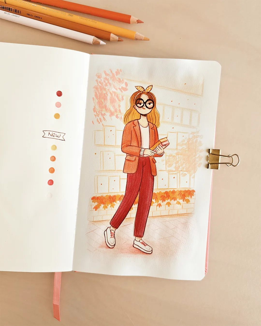 Page de carnet de croquis avec l'illustration d'une femme portant des livres dans ses mains devant une vitrine de librairie, dans des couleurs orange, jaune et rouge.